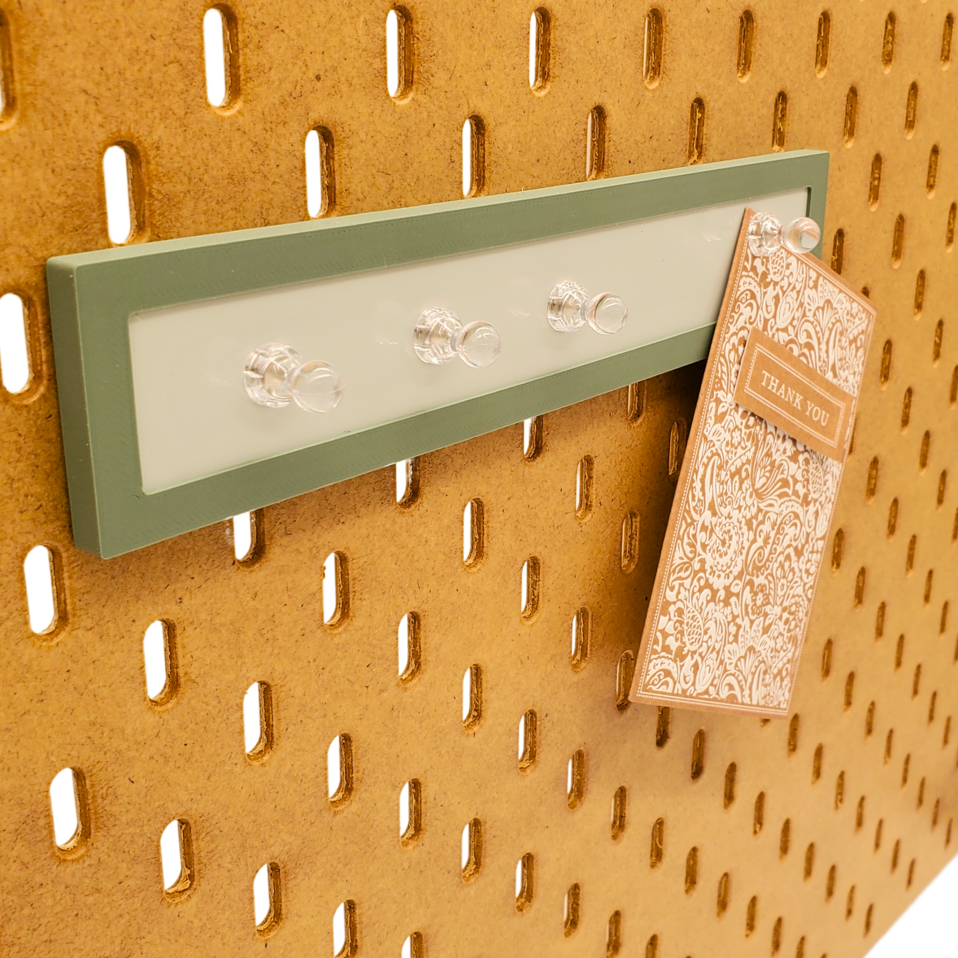 Muted Green Magnet board with Optional 4 Push Pin magnets on a wooden Skadis board