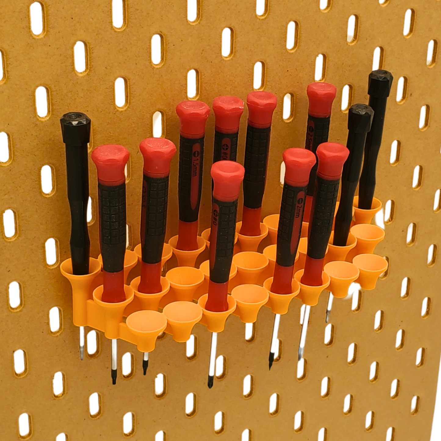 Large screwdriver funnel for SKADIS Pegboard in Orange with screwdriver props. Why do I have three of the same black screwdriver? Definitely not a 10mm...