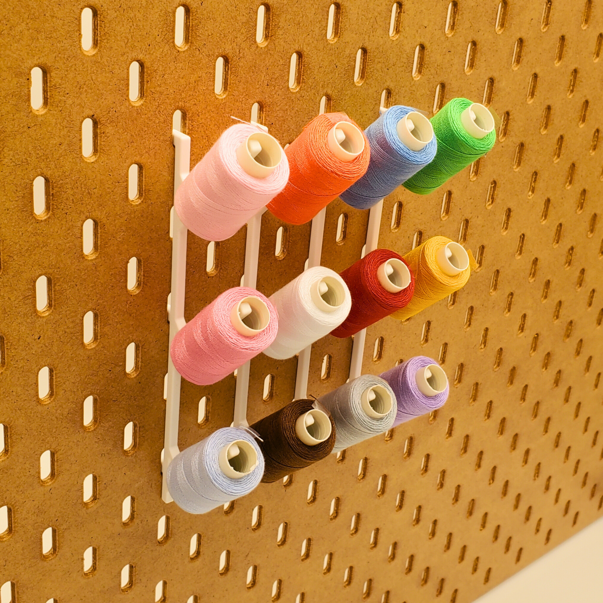 Each Ikea pegboard  Thread display holds 3 threads