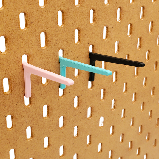 Light Pink, Teal and Charcoal Black Just Hanging SKADIS Pegboard compatible hooks.