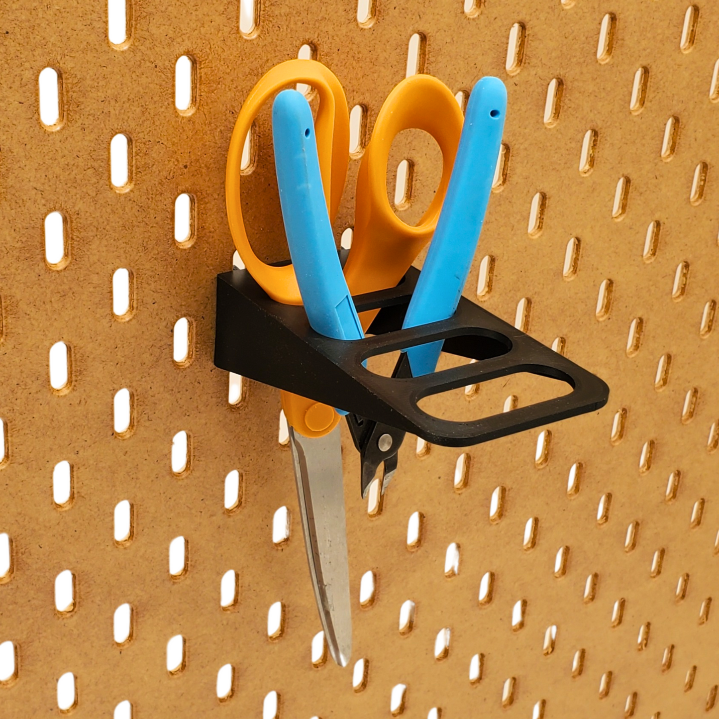 Charcoal Black 4 Slot scissor holder for SKADIS Pegboard with Orange Scissor and Blue side cutter props