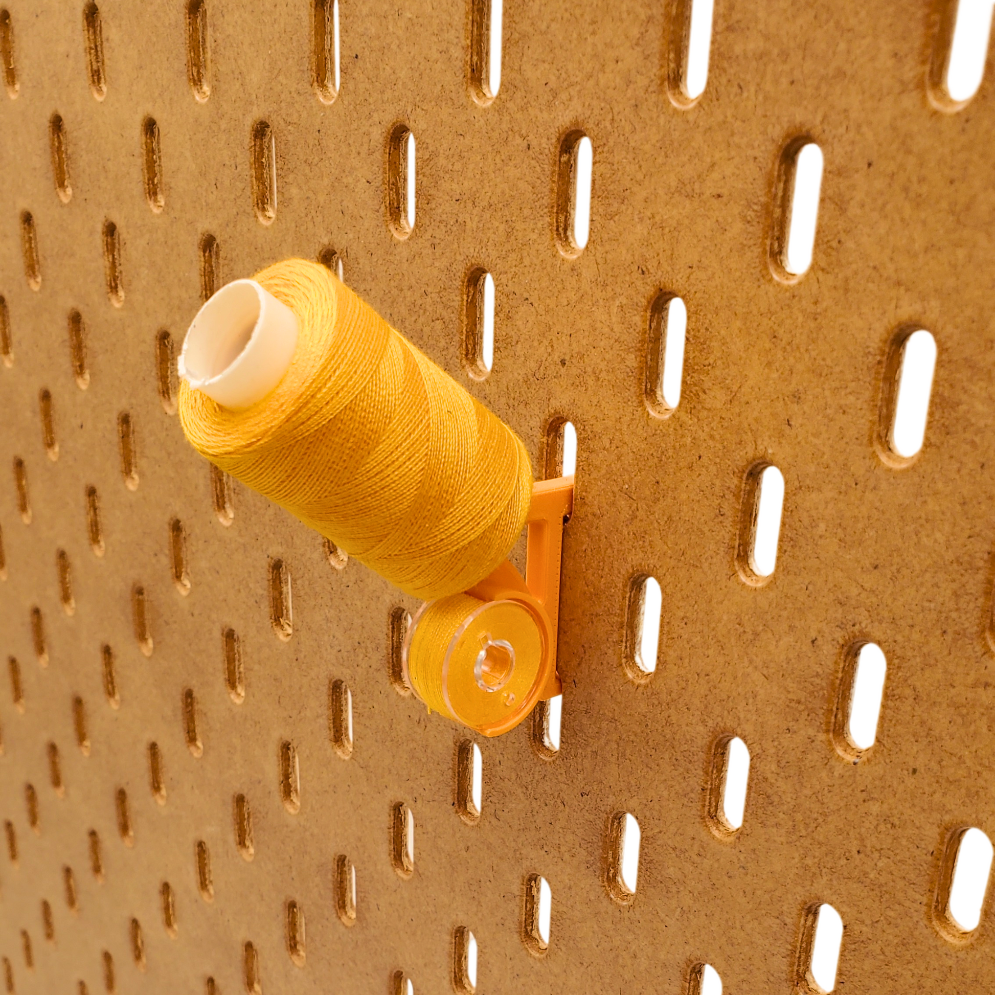 Angled thread and bobbin storage for IKEA Pegboard