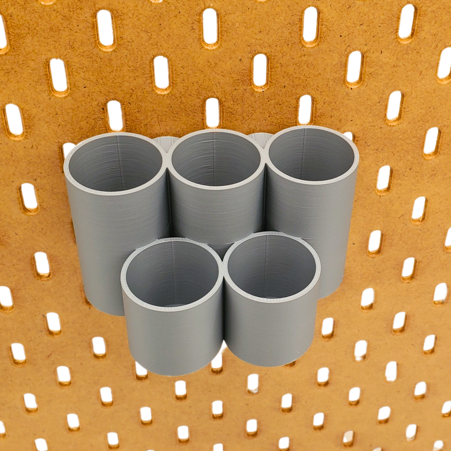 Gray Skadis Pegboard Storage circle bin.