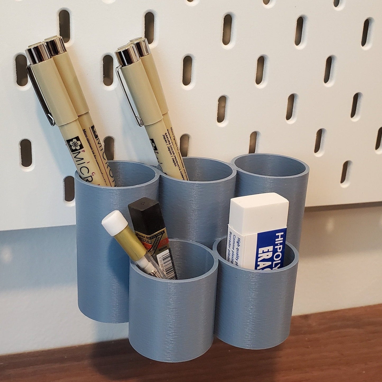 Muted Blue Bin can hang from the very bottom of the pegboard for maximum storage