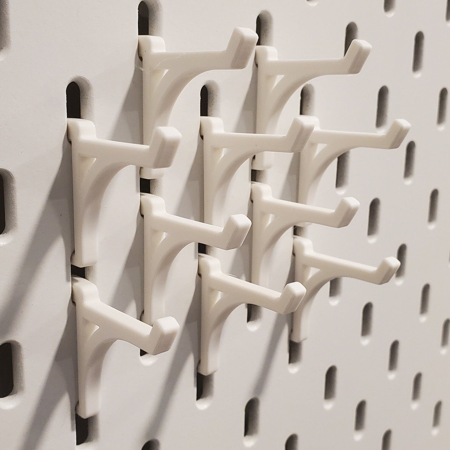 10 Platform display hooks compatible with IKEA SKADIS pegboard in a tight mounting pattern