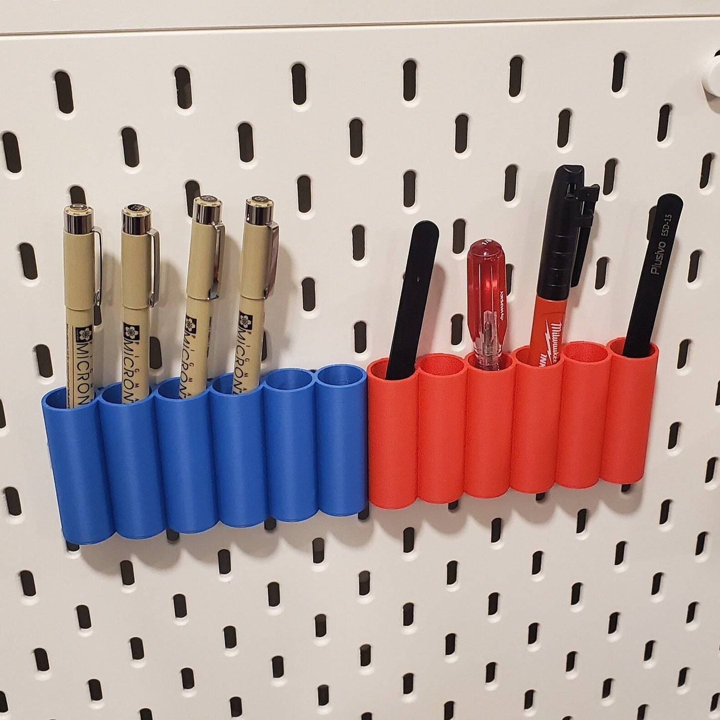 Blue and Red bins mounted side by side on White SKADIS.