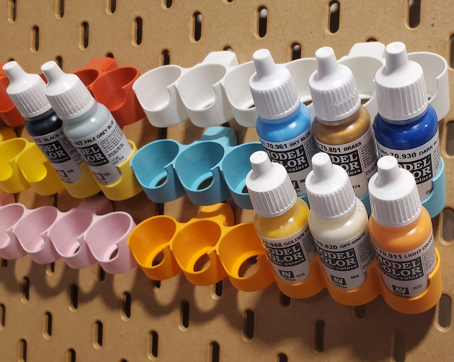 6 Paint racks displayed on an Ikea skadis board