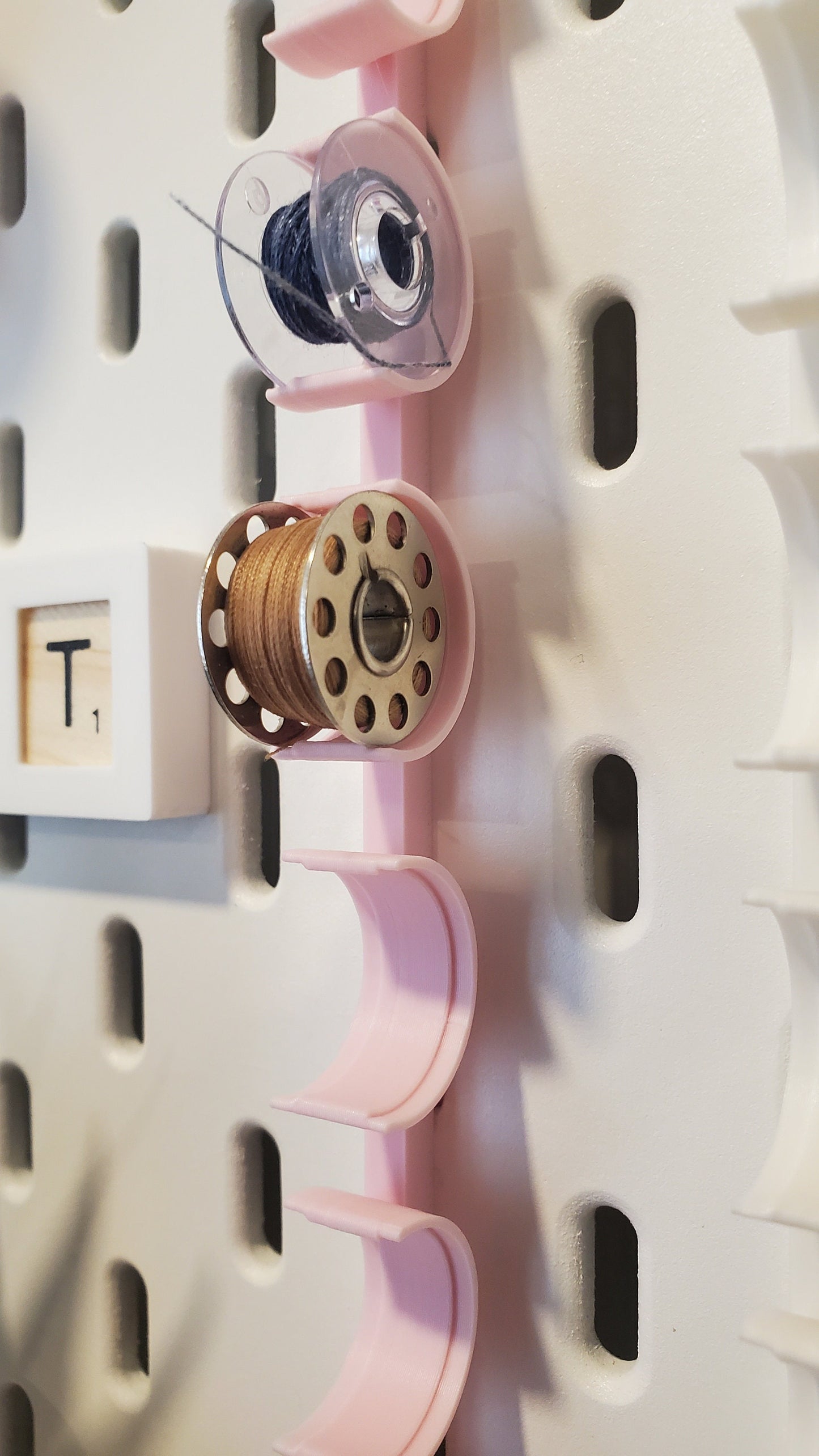 Close up of the Bobbin Storage hooks for IKEA SKADIS Pegboard