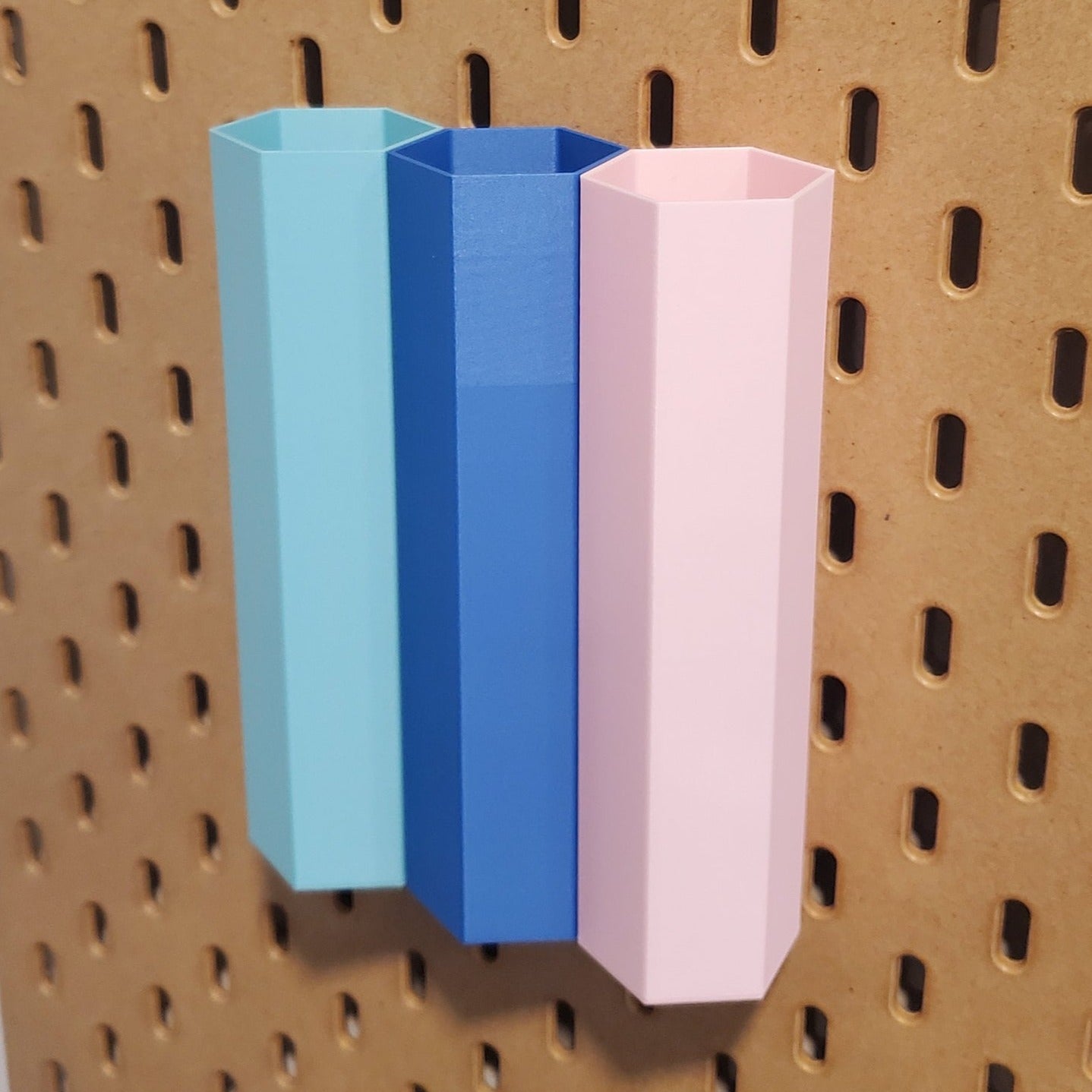 Three Large Hex bins in Teal, Sapphire blue and Light Pink.